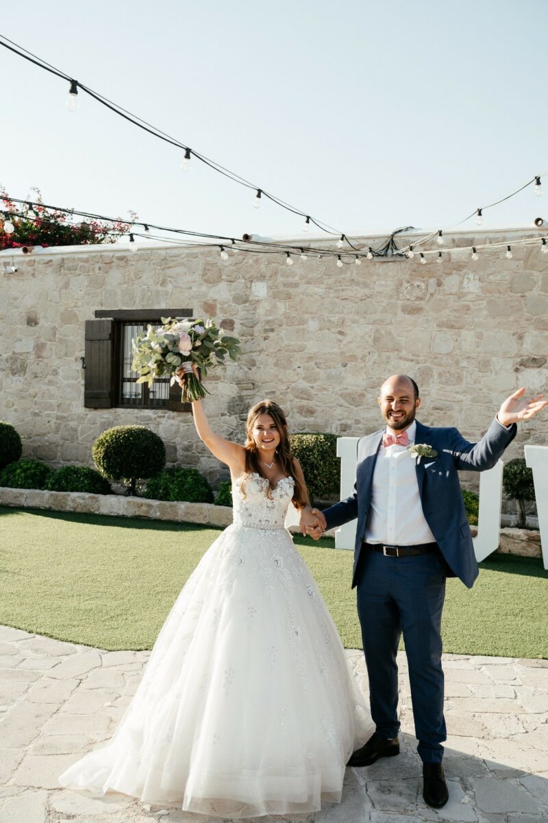 Dahlia wore a beautiful dress from Esposa with a head piece, necklace and earrings to match. Whilst her bridesmaids wore pink dresses. Christopher wore a blue suit from Suit Supply and his groomsmen wore similar suits.